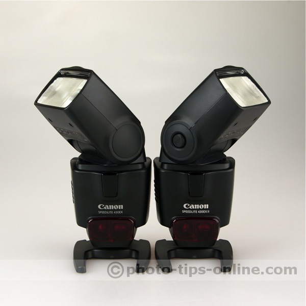 Canon Speedlite 430EX vs. Canon Speedlite 430EX II: front view, heads turned out