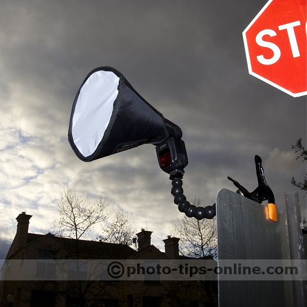 Nasty Clamps: Canon Speedlite 580EX II with Honl Photo traveller8 diffuser mounted onto a road sign