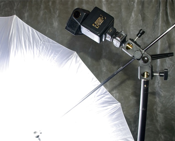 Choosing a Light Stand, Umbrella & Adapter: white shoot-through umbrella positioned in front of the flash